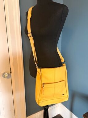 The Sak Buttercup Yellow Pebble Leather Crossbody Bag with Front Zip Pocket